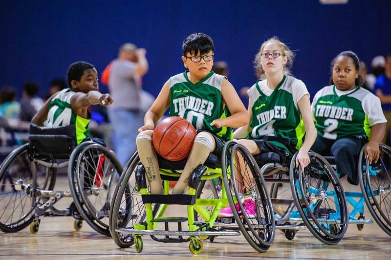 Children playing wheelchair basketball