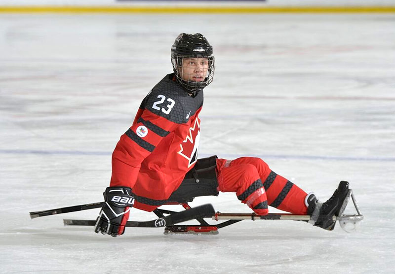 Liam Hickey playing sledge hockey