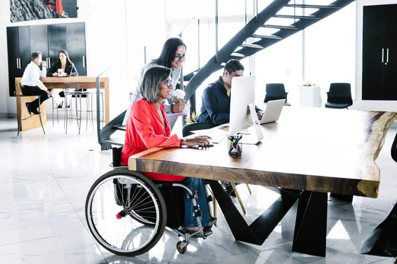 Woman in wheelchair at work