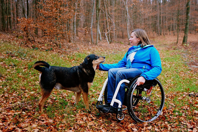 Tracey Ferguson and her dog Koda playing outside