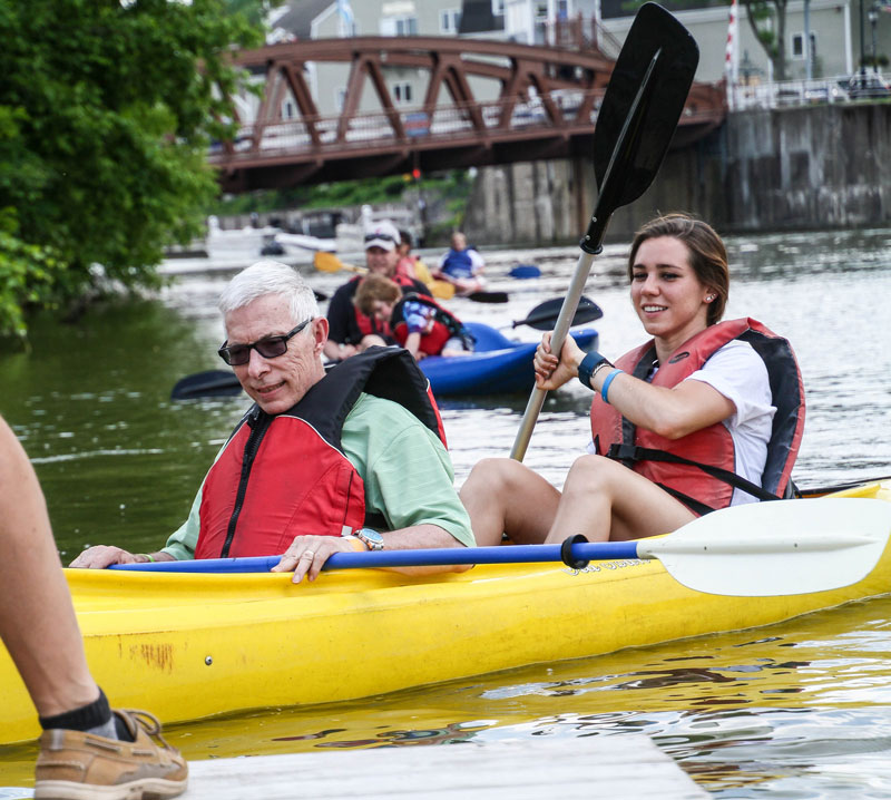 Guest utilizes a volunteer while kayaking.