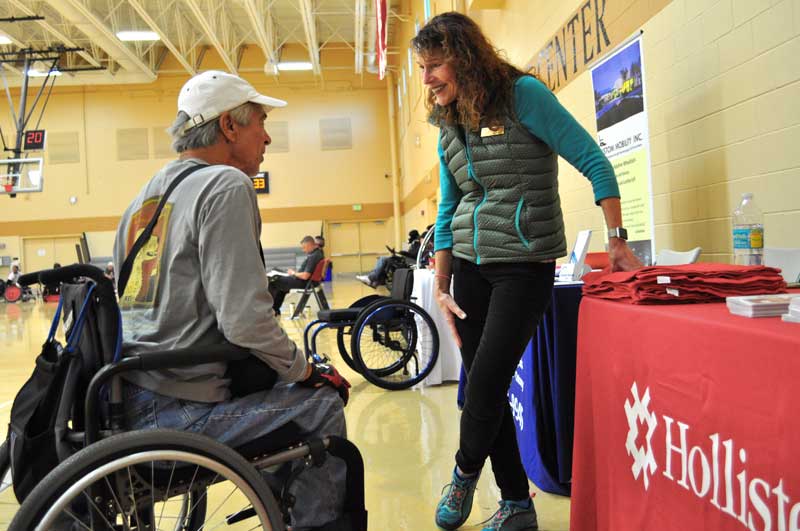 A spectator speaks with a vendor