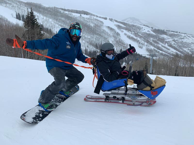 Jessica skiing with an instructor