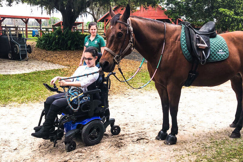 The author walking her horse