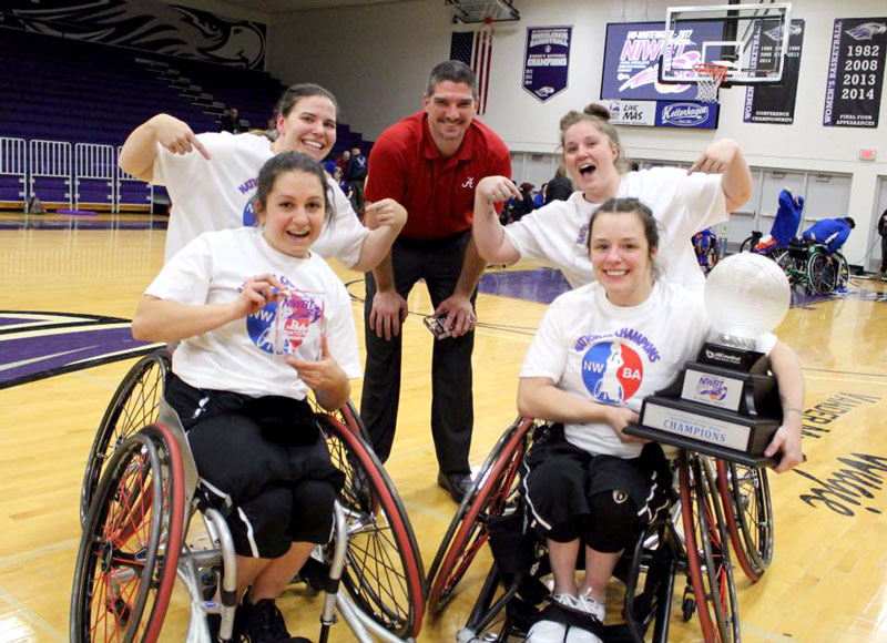 Jamey Jewells (bottom-right) with her team